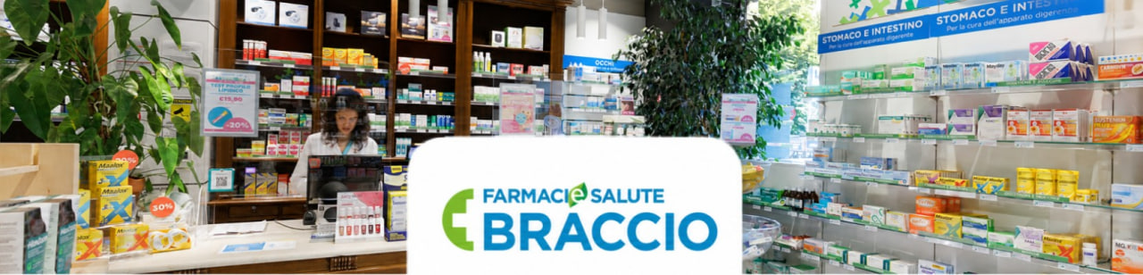 Interno della Farmacia Braccio a Torino, con scaffali di prodotti e reparto dedicato a stomaco e intestino